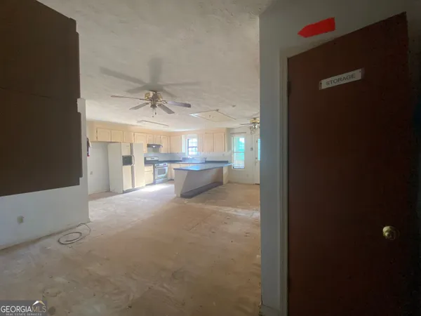 an empty room with a empty space and windows