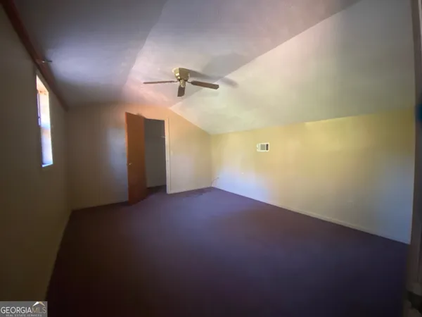 a bathroom with a shower and a toilet