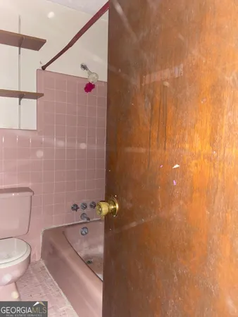 a bathroom with a glass door