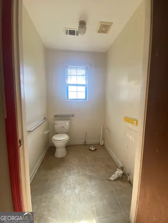 a bathroom with a toilet