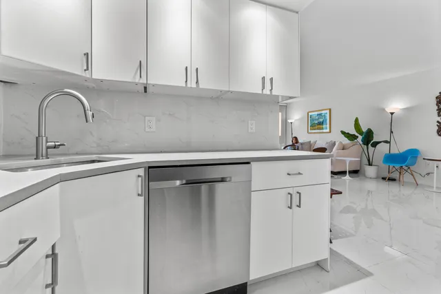a kitchen with a sink and cabinets