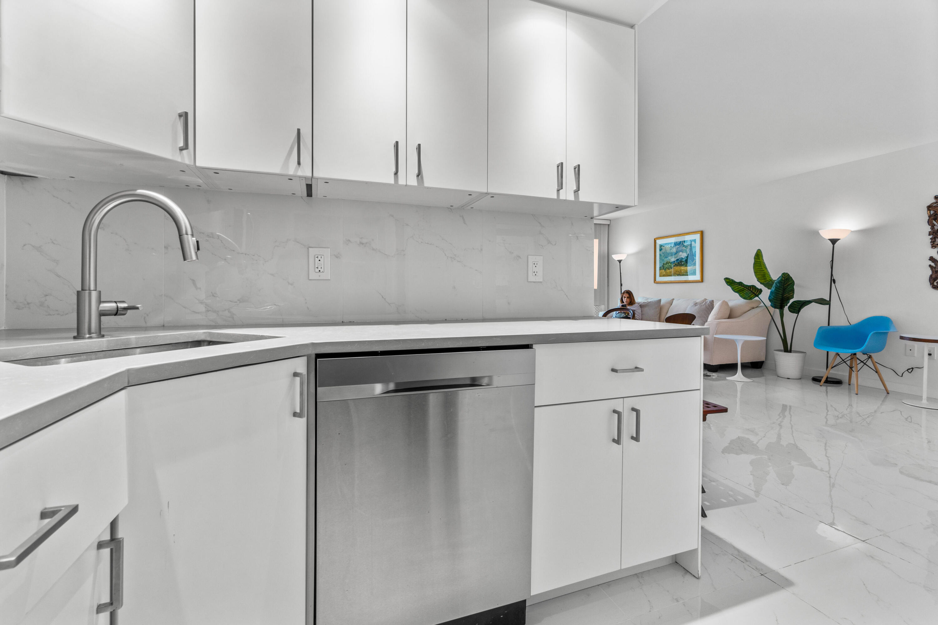 2780 South Ocean Boulevard, Unit 306 Palm Beach, FL 33480 - Photo 13 of 37 a kitchen with a sink and cabinets