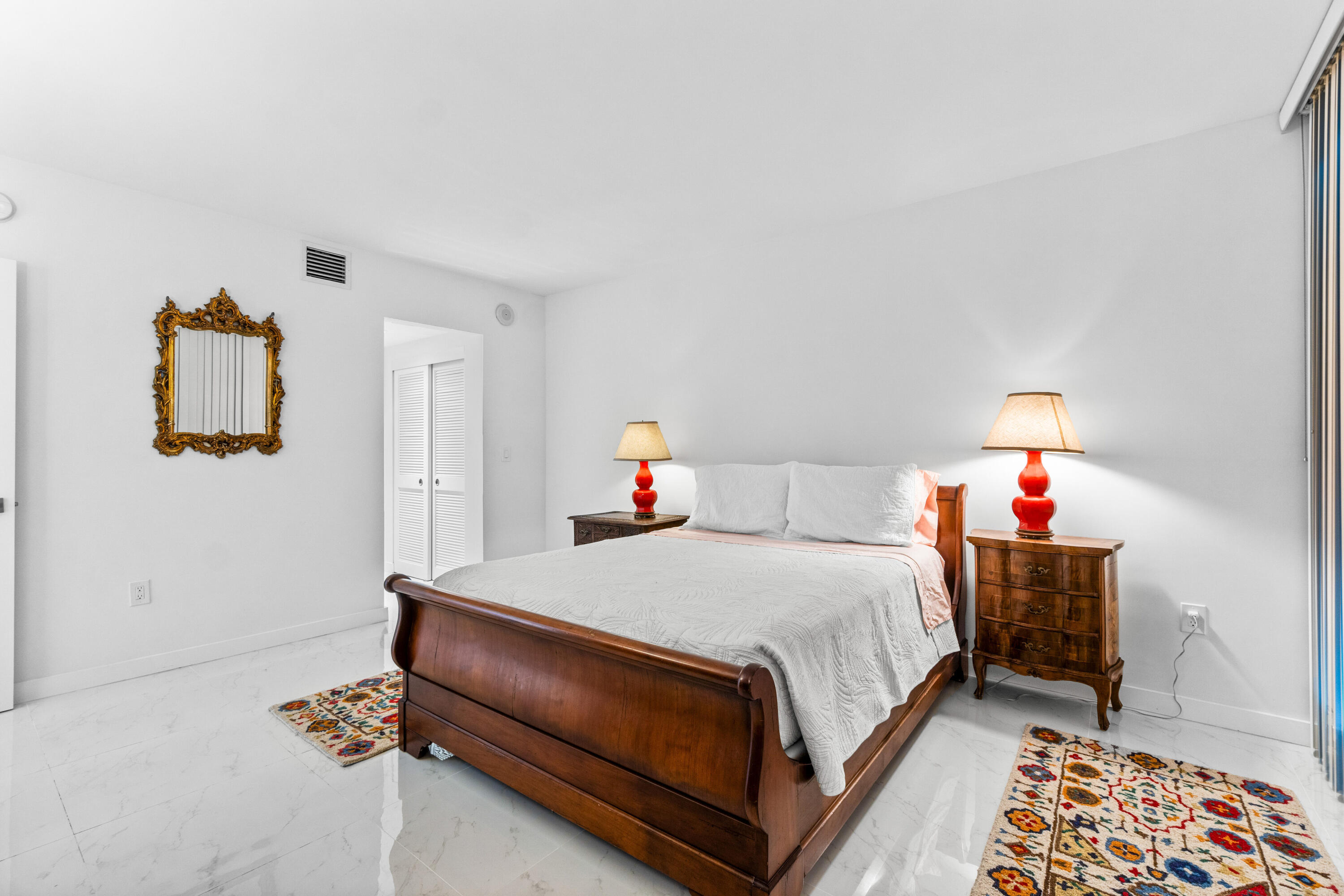 2780 South Ocean Boulevard, Unit 306 Palm Beach, FL 33480 - Photo 17 of 37 a bedroom with a bed and dresser