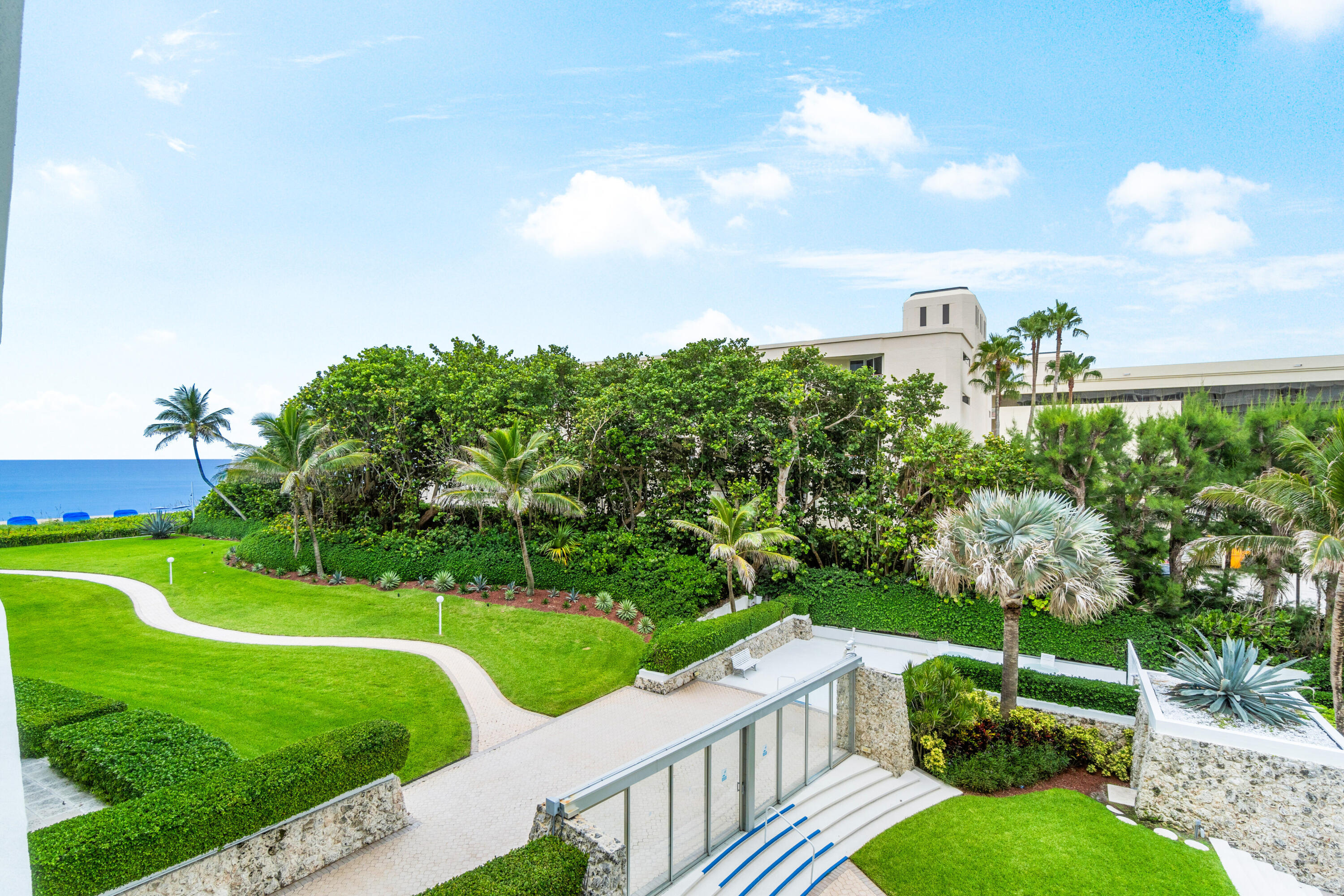 2780 South Ocean Boulevard, Unit 306 Palm Beach, FL 33480 - Photo 2 of 37 a view of a golf course with a garden