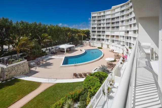 a view of a swimming pool with a patio