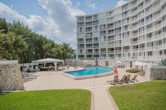 a view of a swimming pool with lounge chairs