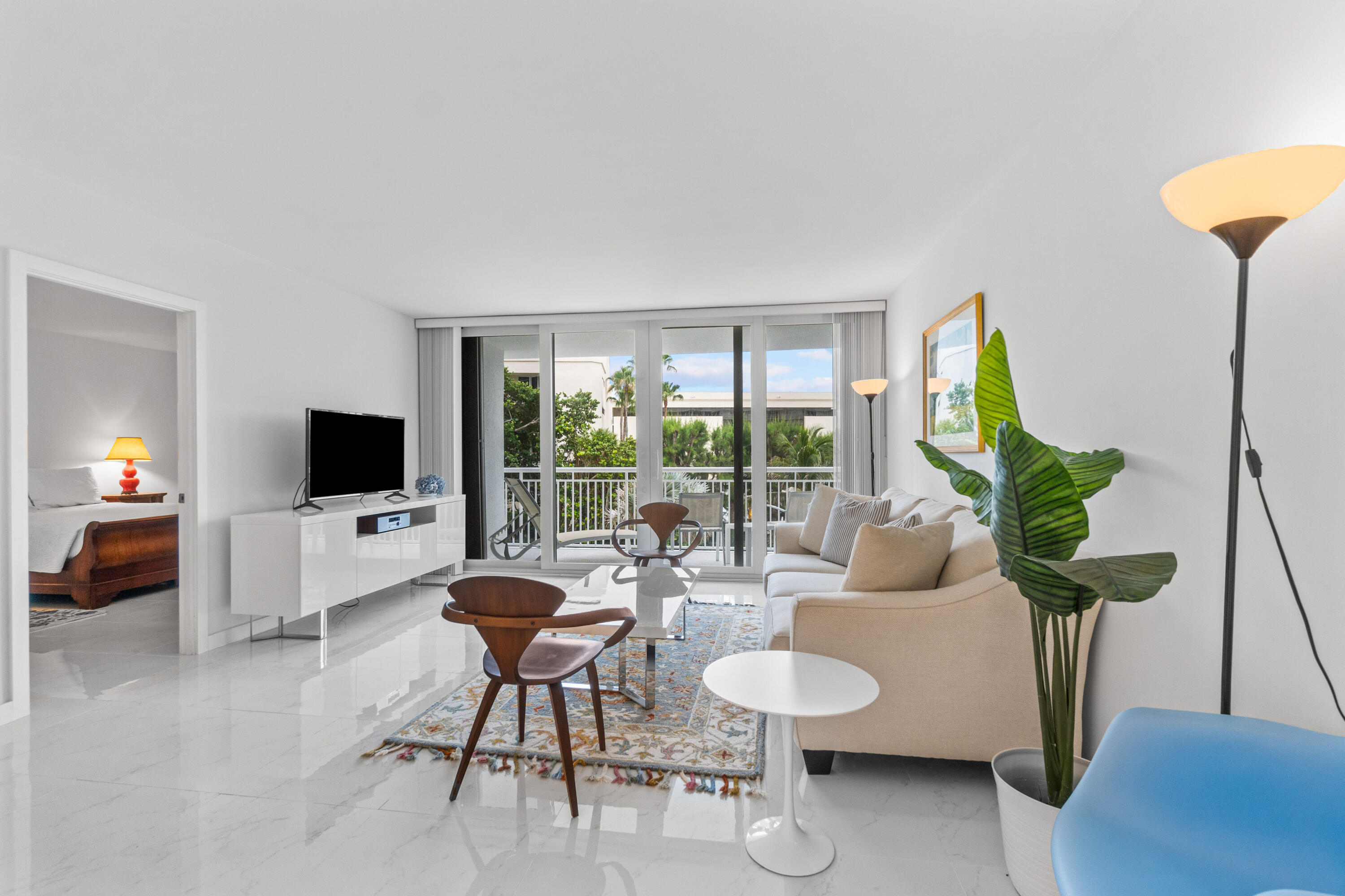 2780 South Ocean Boulevard, Unit 306 Palm Beach, FL 33480 - Photo 6 of 37 a living room with furniture and a flat screen tv