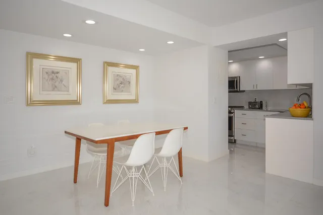 a view of a dining area with furniture and a window