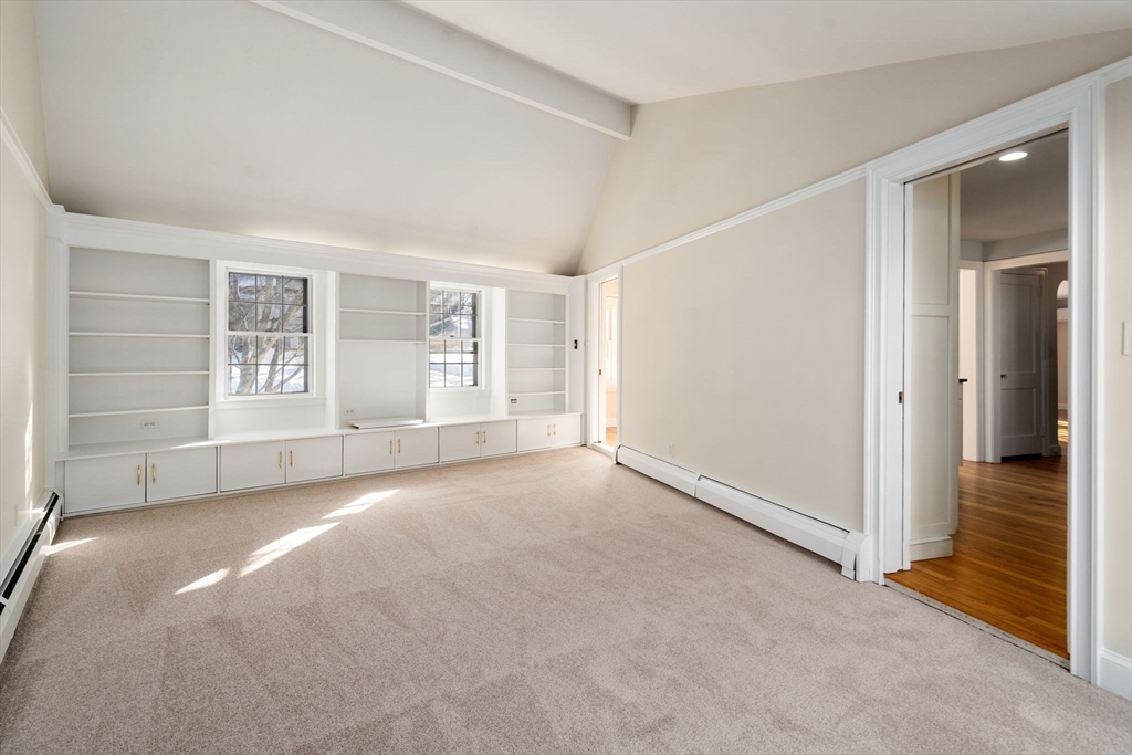 101 Adams Road Concord, MA 01742 - Photo 14 of 26 a view of a big room with windows and chandelier