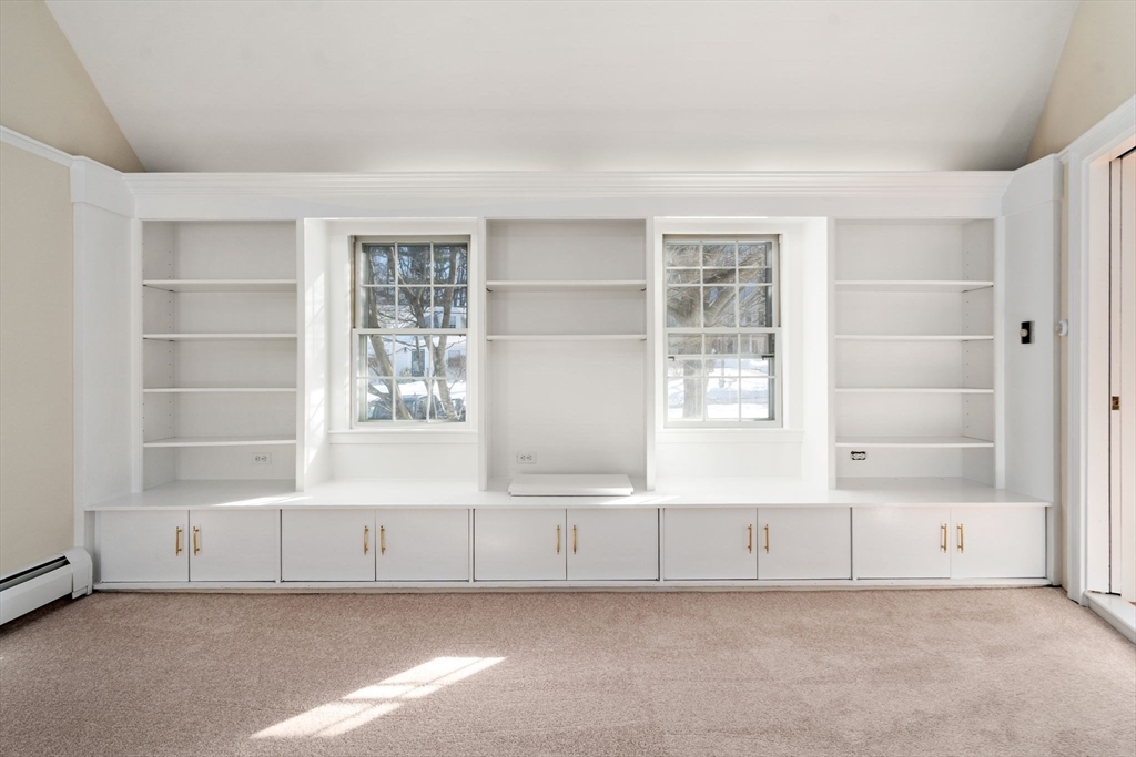 101 Adams Road Concord, MA 01742 - Photo 15 of 26 a view of an empty room with a window