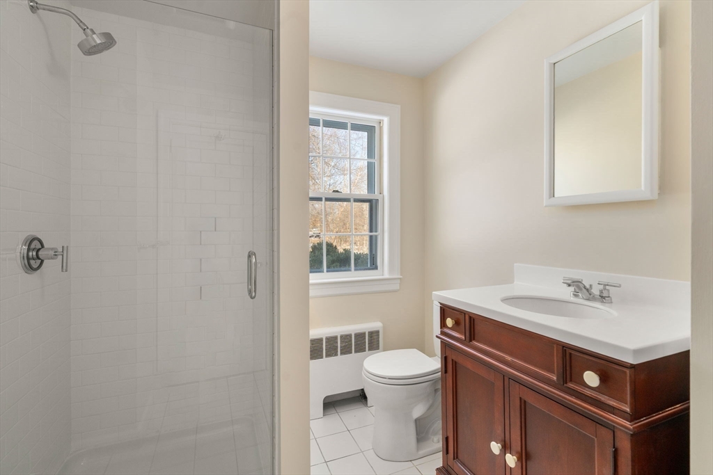 101 Adams Road Concord, MA 01742 - Photo 19 of 26 a bathroom with a sink toilet and window
