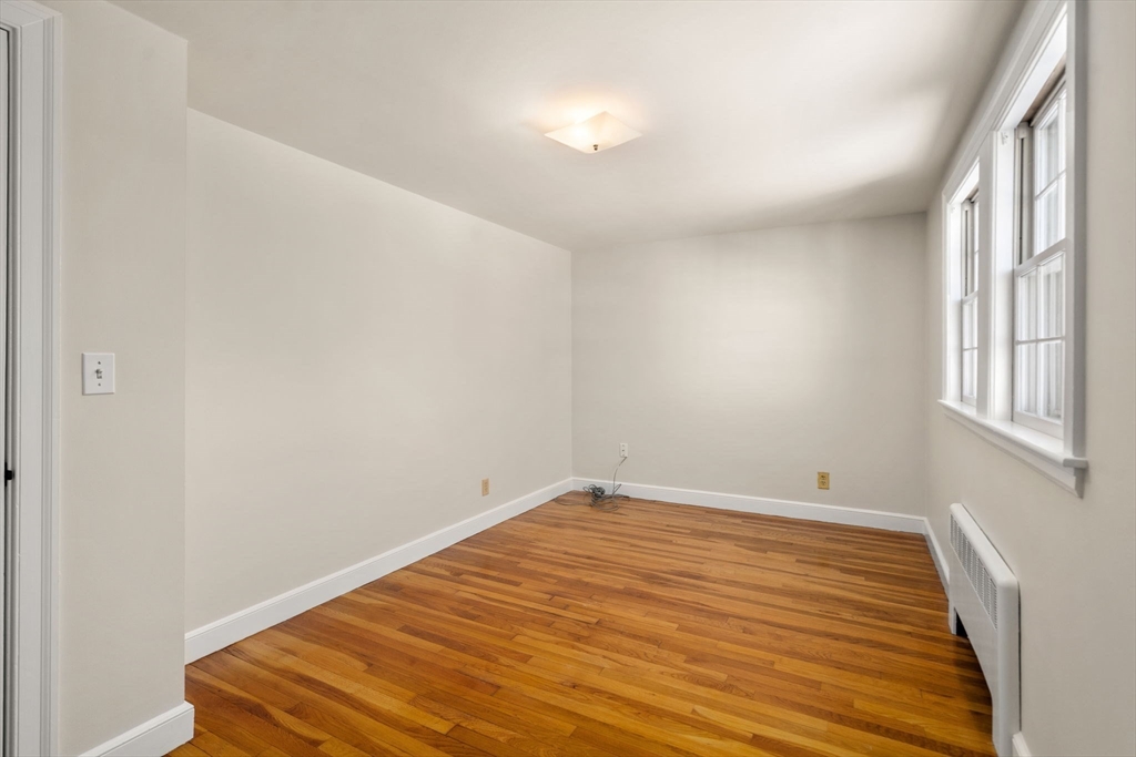 101 Adams Road Concord, MA 01742 - Photo 25 of 26 a view of a room with wooden floor and a window