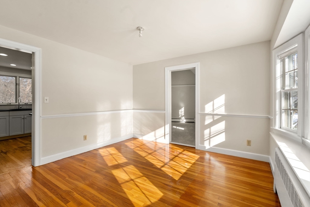 101 Adams Road Concord, MA 01742 - Photo 10 of 26 a view of empty room with wooden floor
