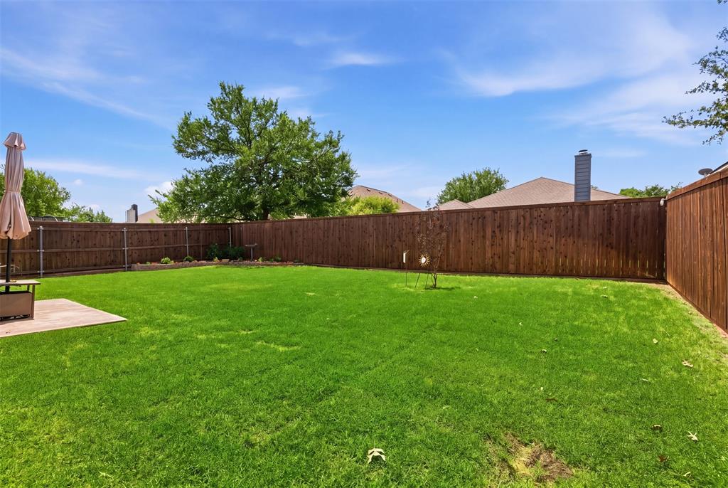 5491 Exeter Drive Prosper, TX 75078 - Photo 19 of 20 a view of yard with swimming pool and green space