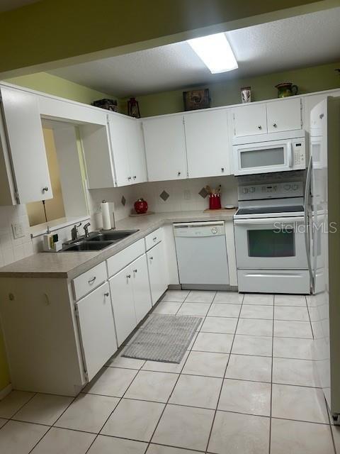 8670 Southwest 97th Street, Unit A Ocala, FL 34481 - Photo 11 of 15 a kitchen with cabinets and appliances