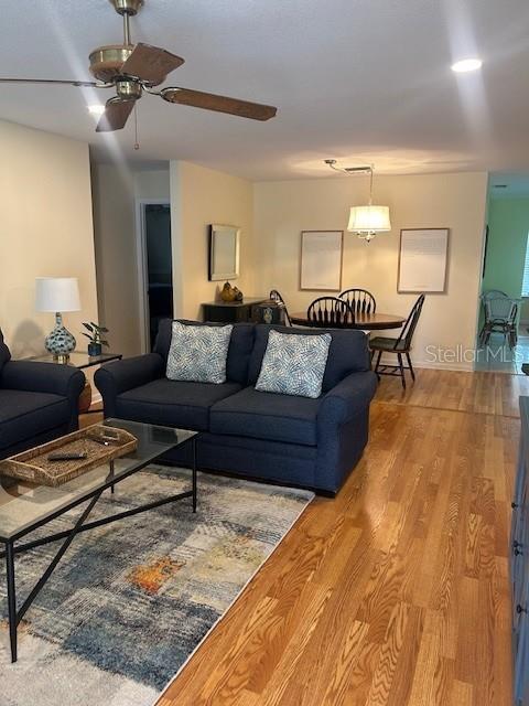 8670 Southwest 97th Street, Unit A Ocala, FL 34481 - Photo 2 of 15 a living room with furniture and a chandelier