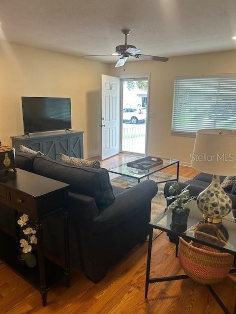 8670 Southwest 97th Street, Unit A Ocala, FL 34481 - Photo 4 of 15 a living room with furniture and a flat screen tv