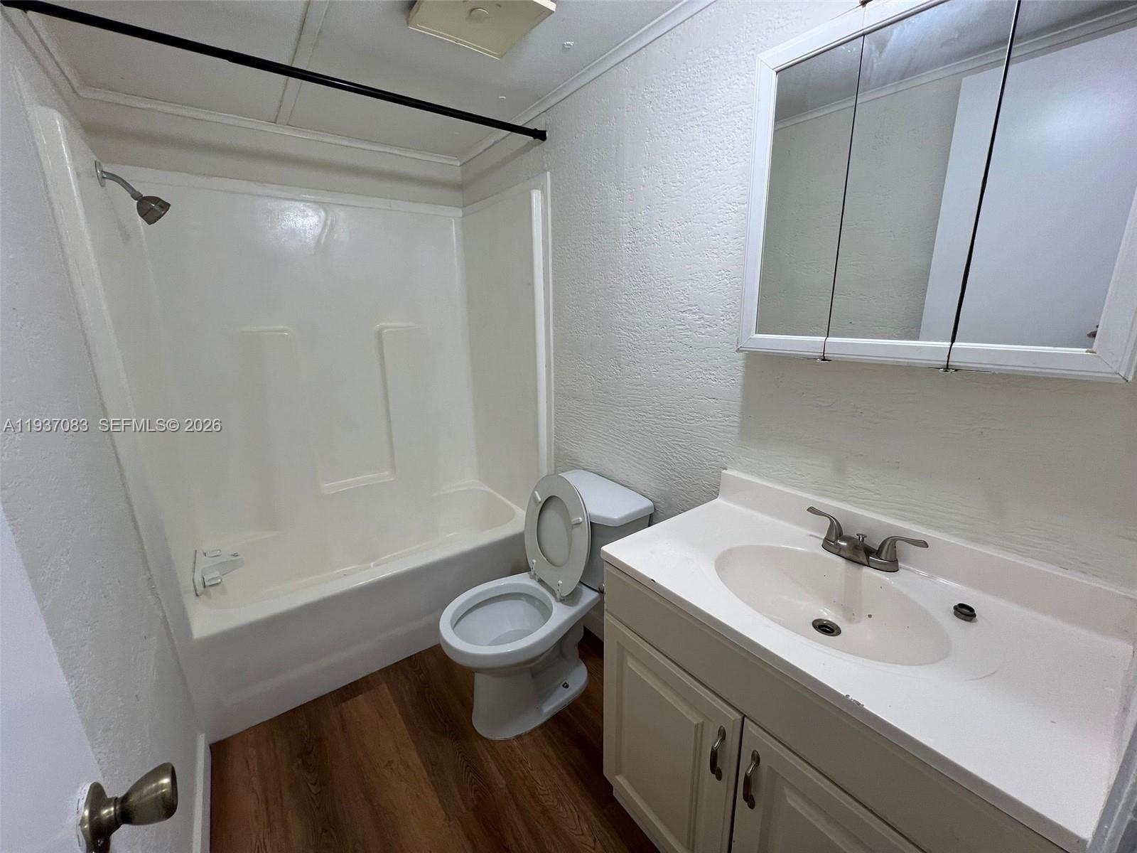 10492 South 228th Lane, Unit A Boca Raton, FL 33428 - Photo 25 of 37 a bathroom with a sink a toilet and shower