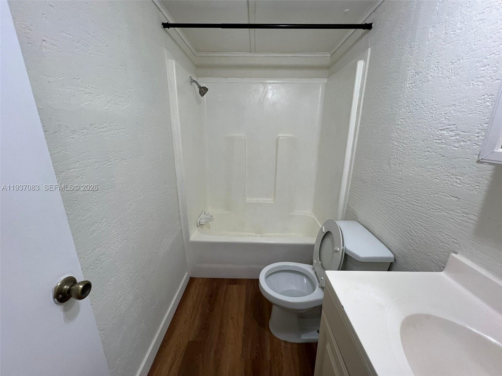 10492 South 228th Lane, Unit A Boca Raton, FL 33428 - Photo 26 of 37 a bathroom with a sink and a toilet