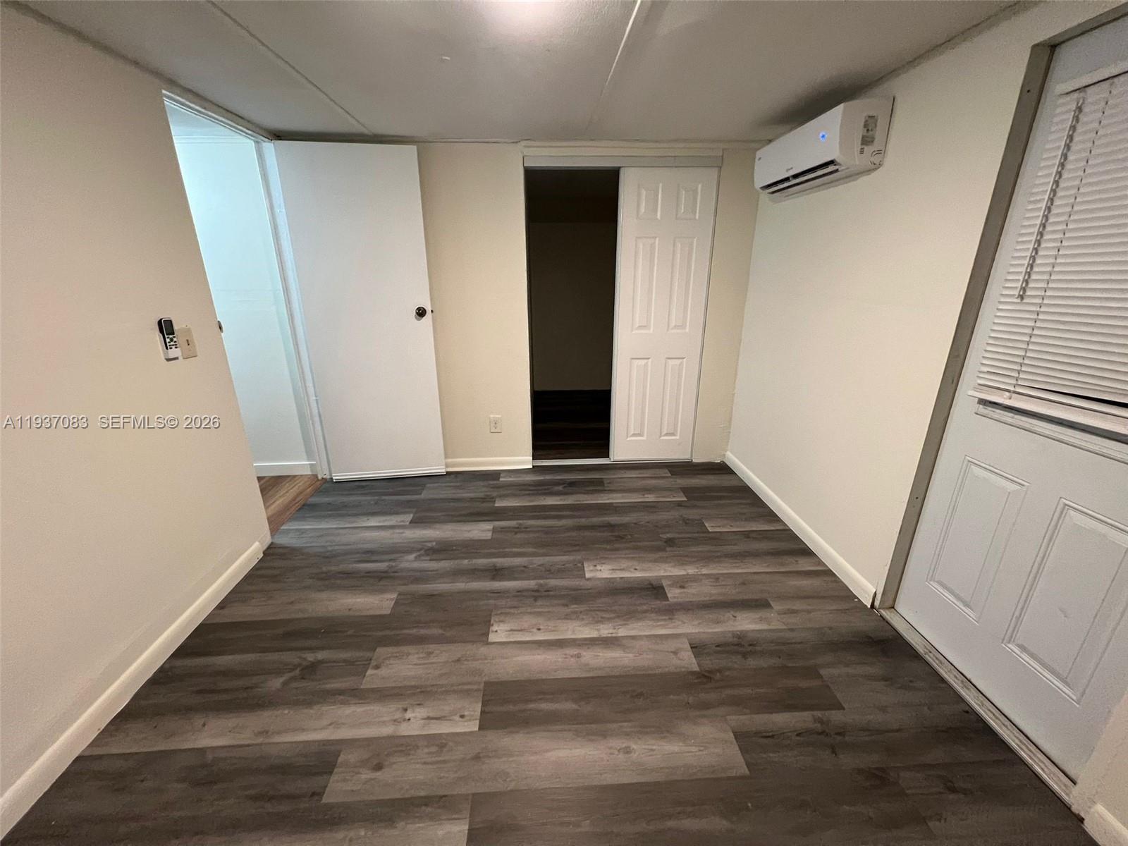10492 South 228th Lane, Unit A Boca Raton, FL 33428 - Photo 29 of 37 a view of a hallway with wooden floor and staircase