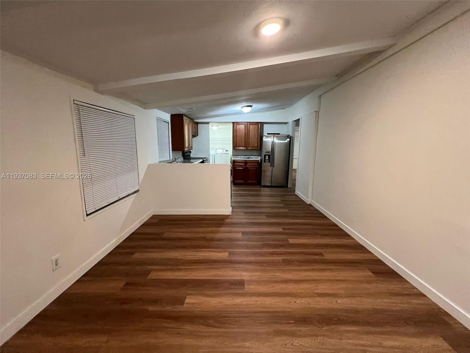 10492 South 228th Lane, Unit A Boca Raton, FL 33428 - Photo 35 of 37 a view of a room with wooden floor