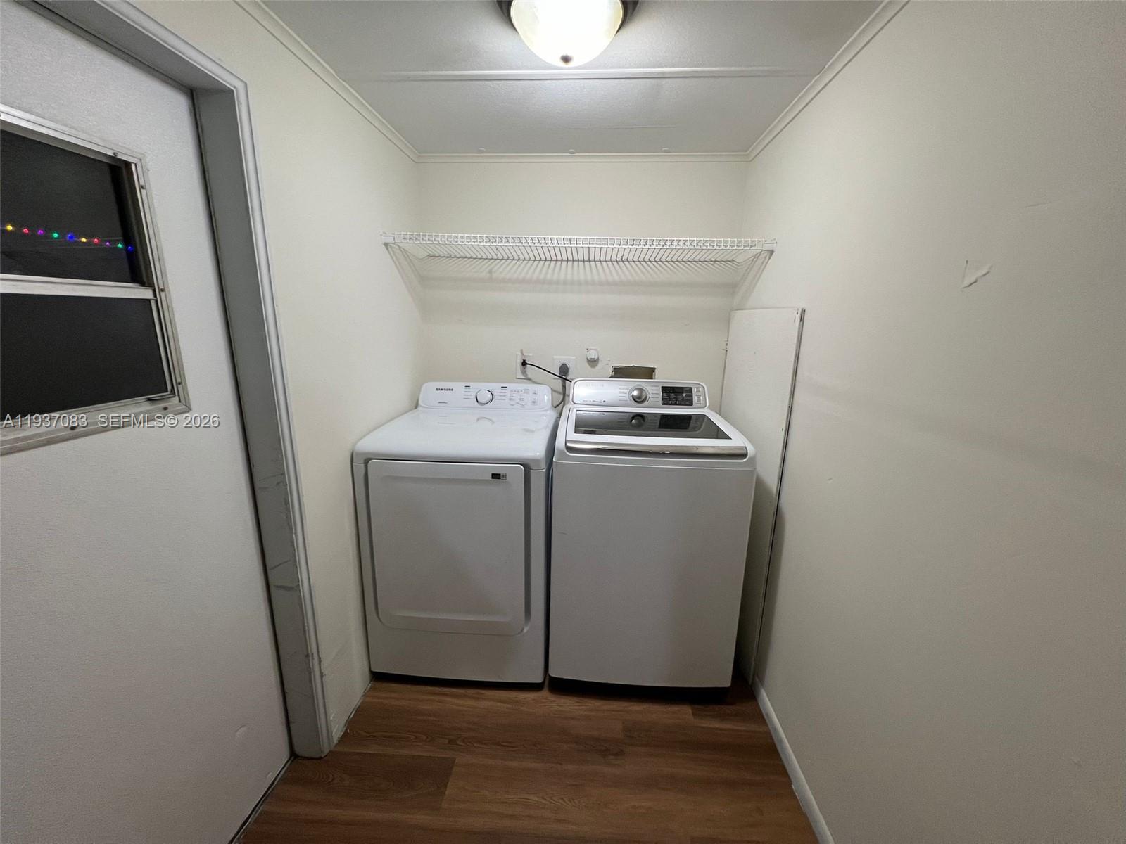 10492 South 228th Lane, Unit A Boca Raton, FL 33428 - Photo 37 of 37 a utility room with wooden floor washer and dryer