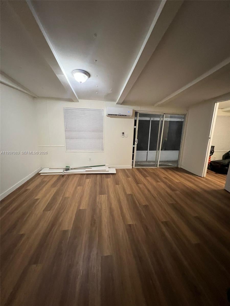 10492 South 228th Lane, Unit A Boca Raton, FL 33428 - Photo 8 of 37 a view of a room with wooden floor and car parked