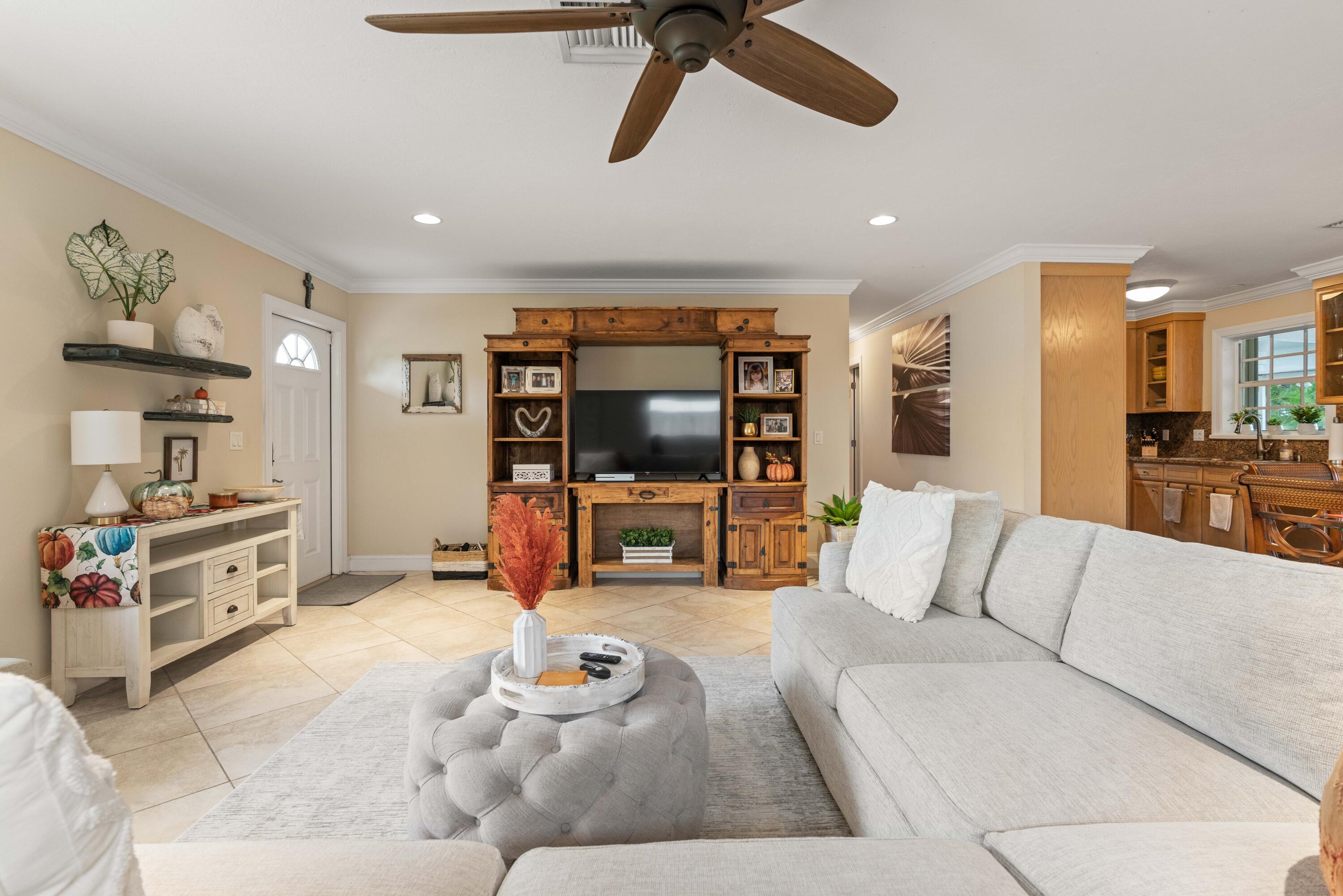 212 West Whitney Drive Jupiter, FL 33458 - Photo 13 of 23 a living room with furniture and a flat screen tv