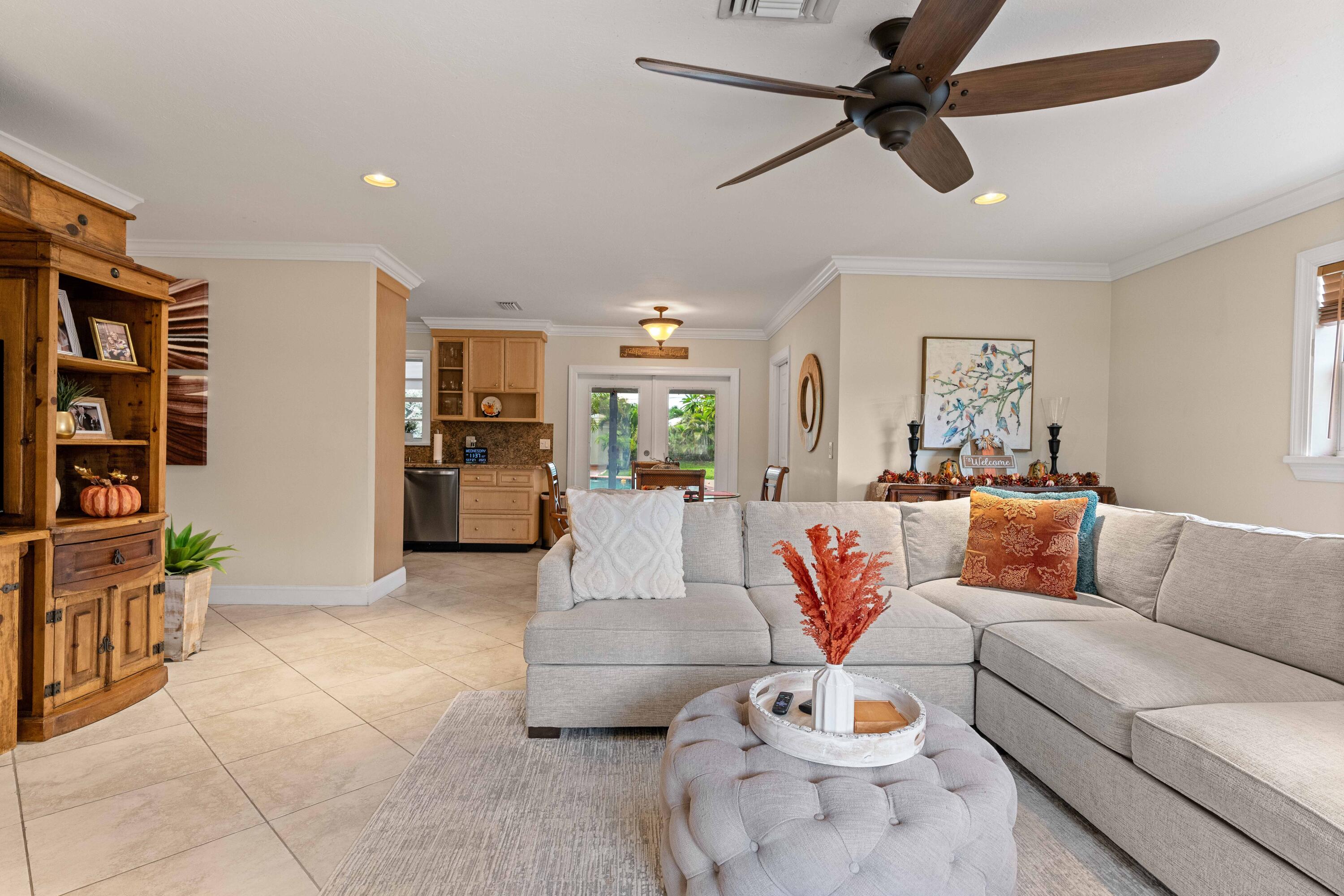 212 West Whitney Drive Jupiter, FL 33458 - Photo 16 of 23 a living room with furniture and kitchen view