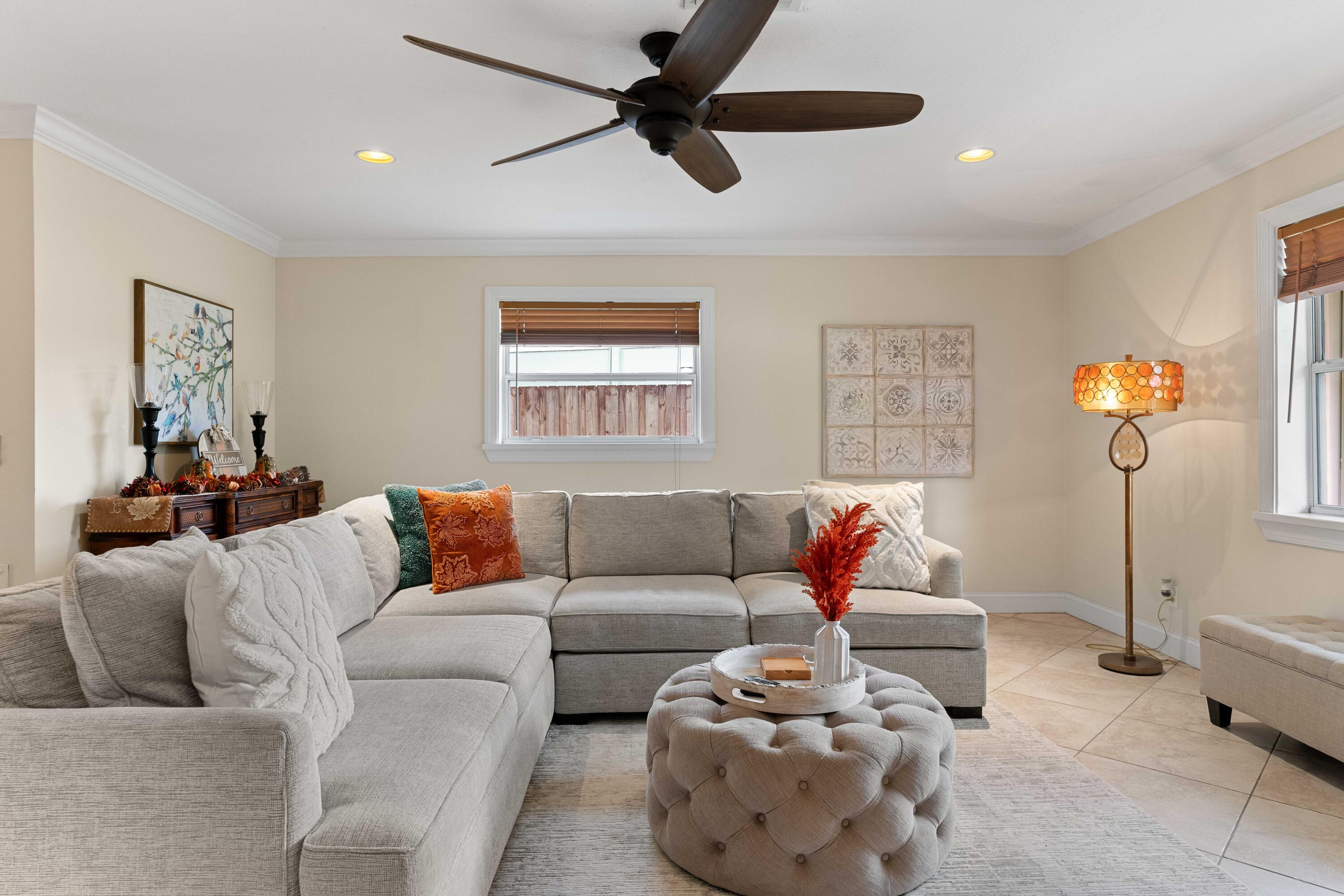 212 West Whitney Drive Jupiter, FL 33458 - Photo 17 of 23 a living room with furniture and a large window