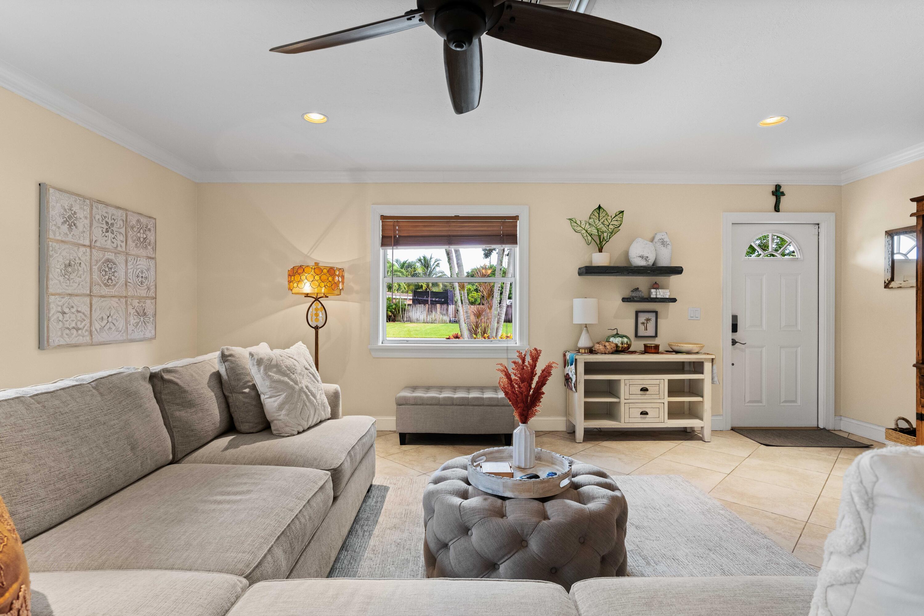 212 West Whitney Drive Jupiter, FL 33458 - Photo 4 of 23 a bedroom with furniture and window