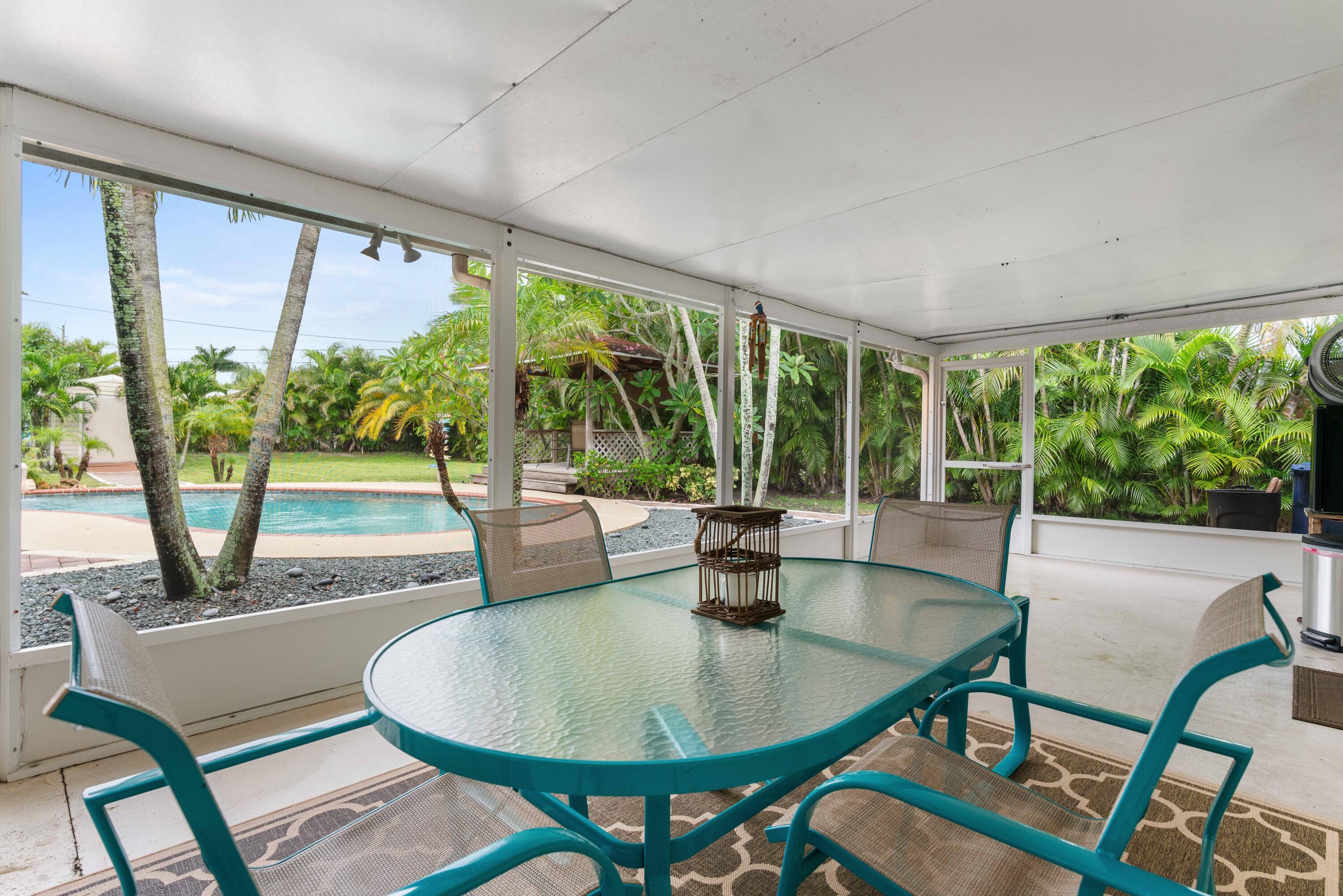 212 West Whitney Drive Jupiter, FL 33458 - Photo 5 of 23 a view of a dining room with furniture window and outside view