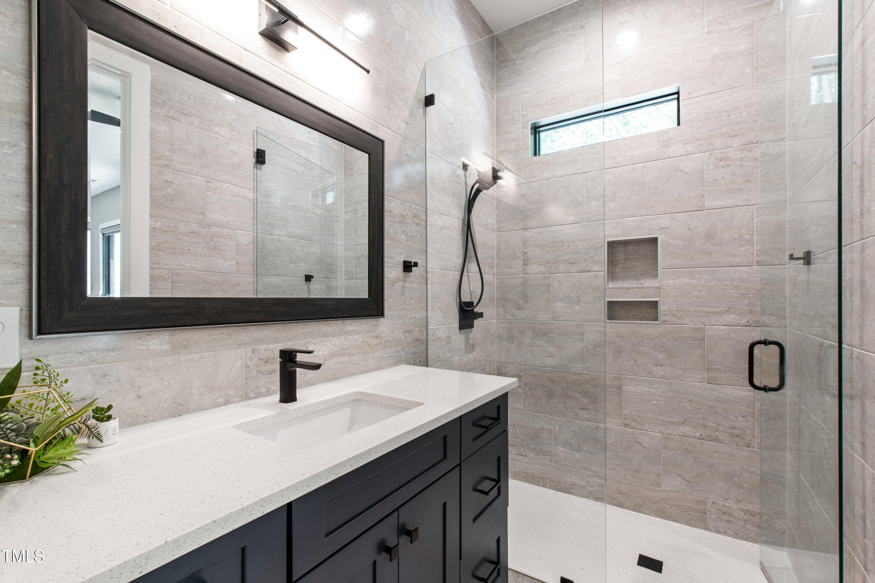 12912 Creedmoor Road Wake Forest, NC 27587 - Photo 22 of 43 Bedroom #2 attached bathroom with floor to ceiling tile
