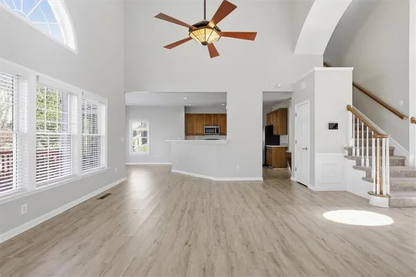 a large kitchen with granite countertop a stove and a sink