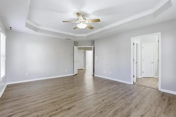 a large kitchen with a sink and cabinets