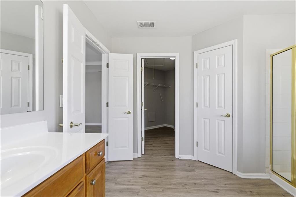 1660 Rosemist Trail Grayson, GA 30017 - Photo 26 of 52 a spacious bathroom with a tub shower and sink