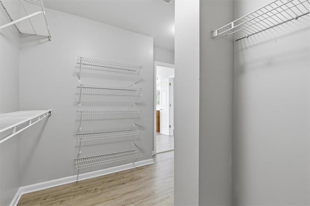 1660 Rosemist Trail Grayson, GA 30017 - Photo 28 of 52 a view of walk in closet with empty racks