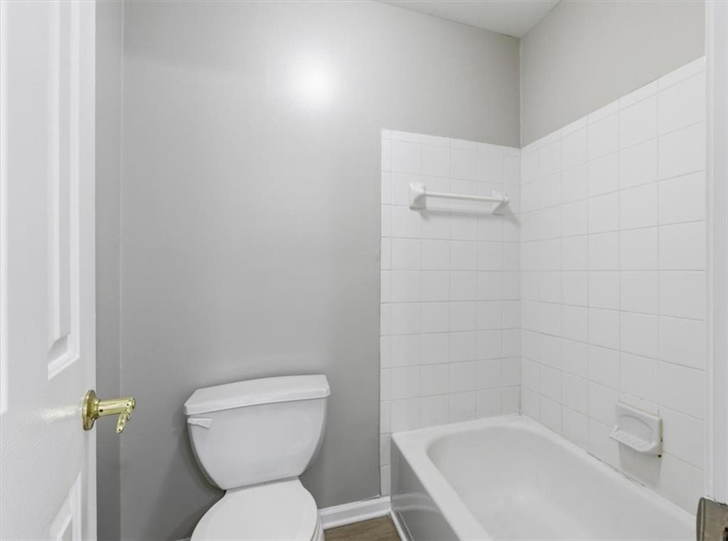 1660 Rosemist Trail Grayson, GA 30017 - Photo 31 of 52 a bathroom with a toilet and a bathtub