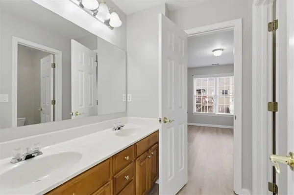 a bathroom with a toilet and a bathtub