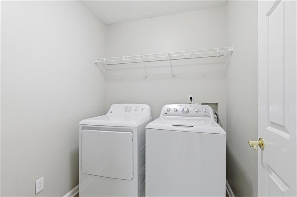 1660 Rosemist Trail Grayson, GA 30017 - Photo 35 of 52 a utility room with dryer and washer