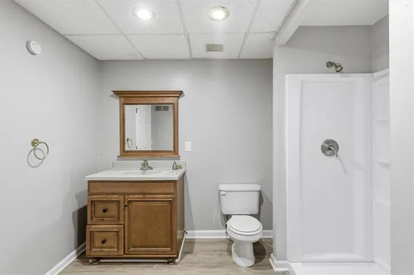 a view of balcony with wooden floor and fence