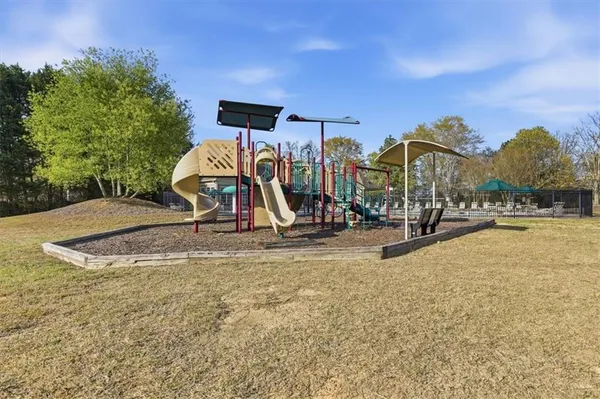 a view of a swimming pool with outdoor seating