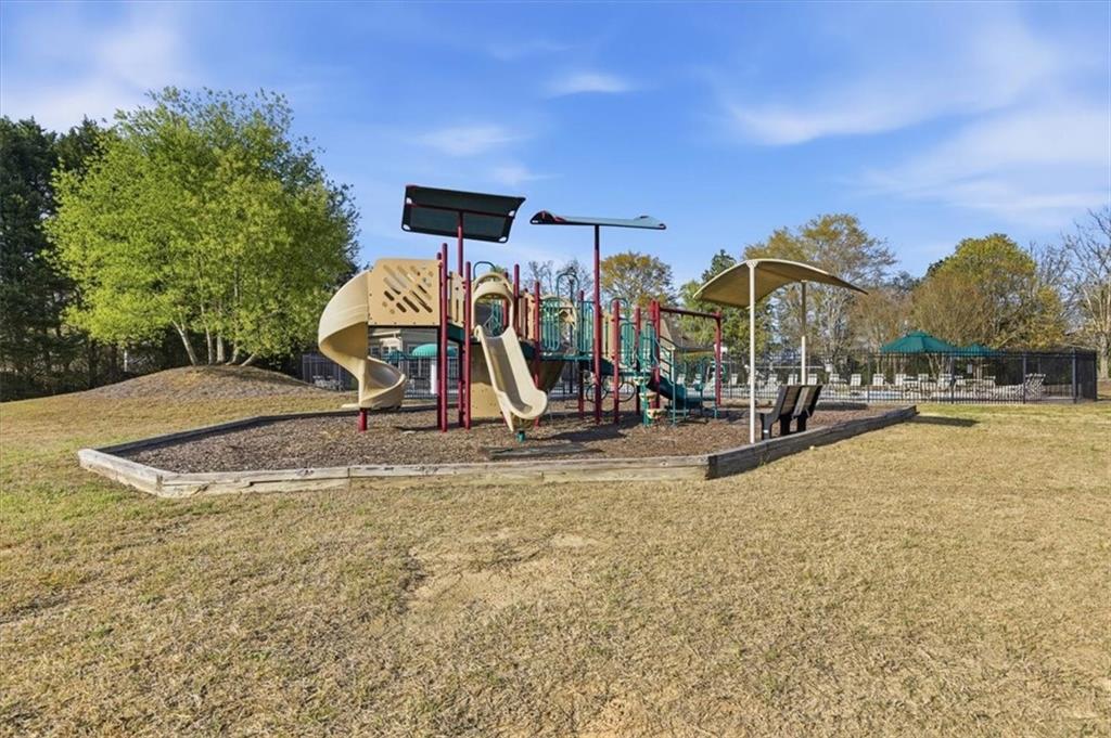 1660 Rosemist Trail Grayson, GA 30017 - Photo 47 of 52 a view of a playground with basketball court