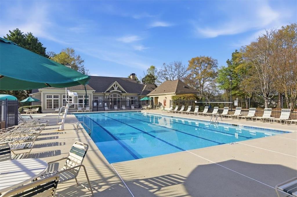 1660 Rosemist Trail Grayson, GA 30017 - Photo 48 of 52 a view of a swimming pool with outdoor seating