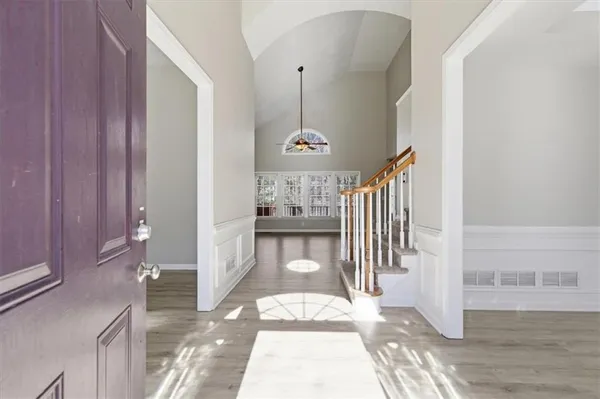a view of a hallway with windows