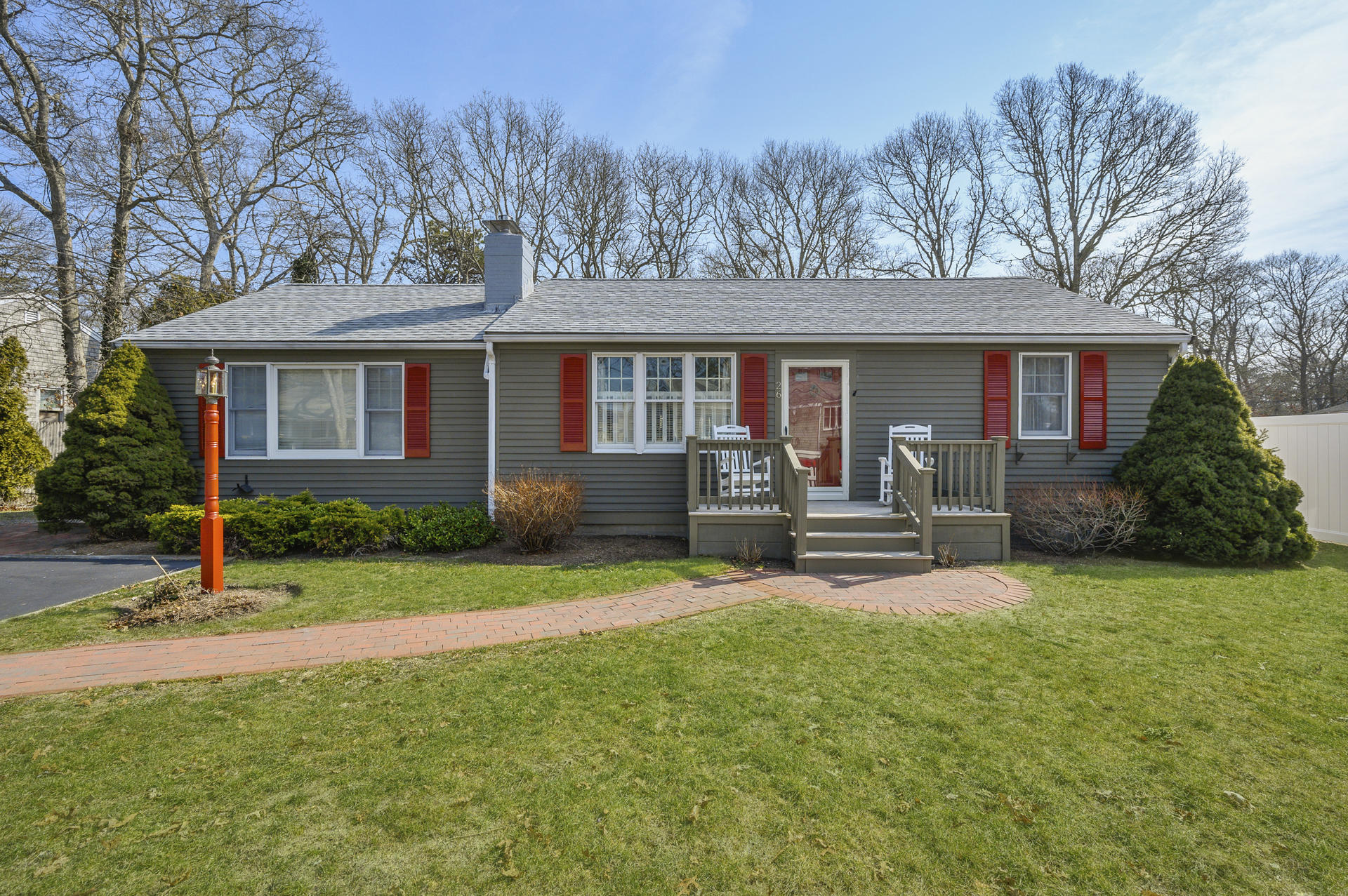 26 Harbor Hills Road Centerville, MA 02632 - Photo 1 of 20 a view of a house with a patio and a yard