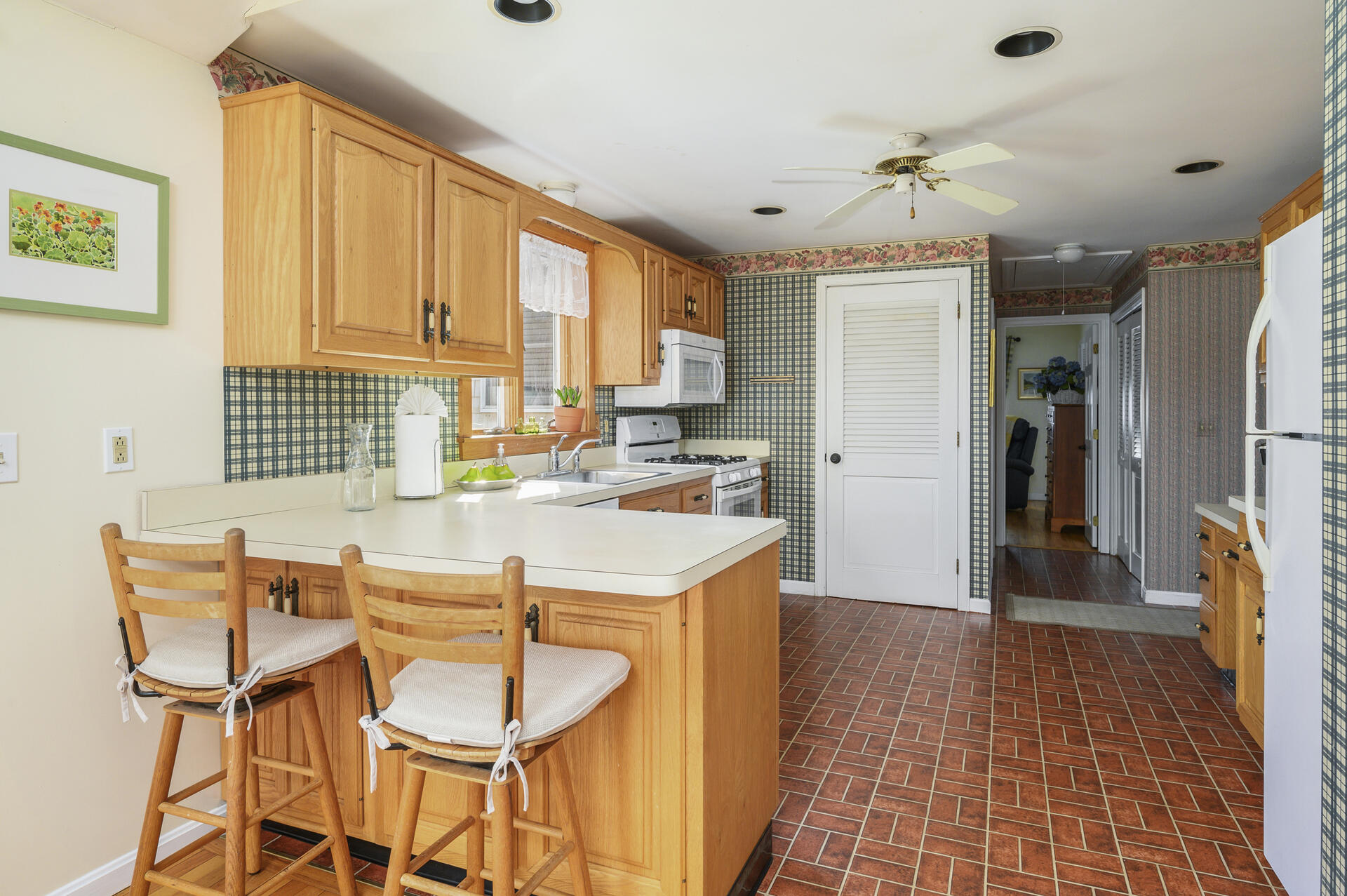 26 Harbor Hills Road Centerville, MA 02632 - Photo 8 of 20 a dining room with granite countertop furniture and a fireplace