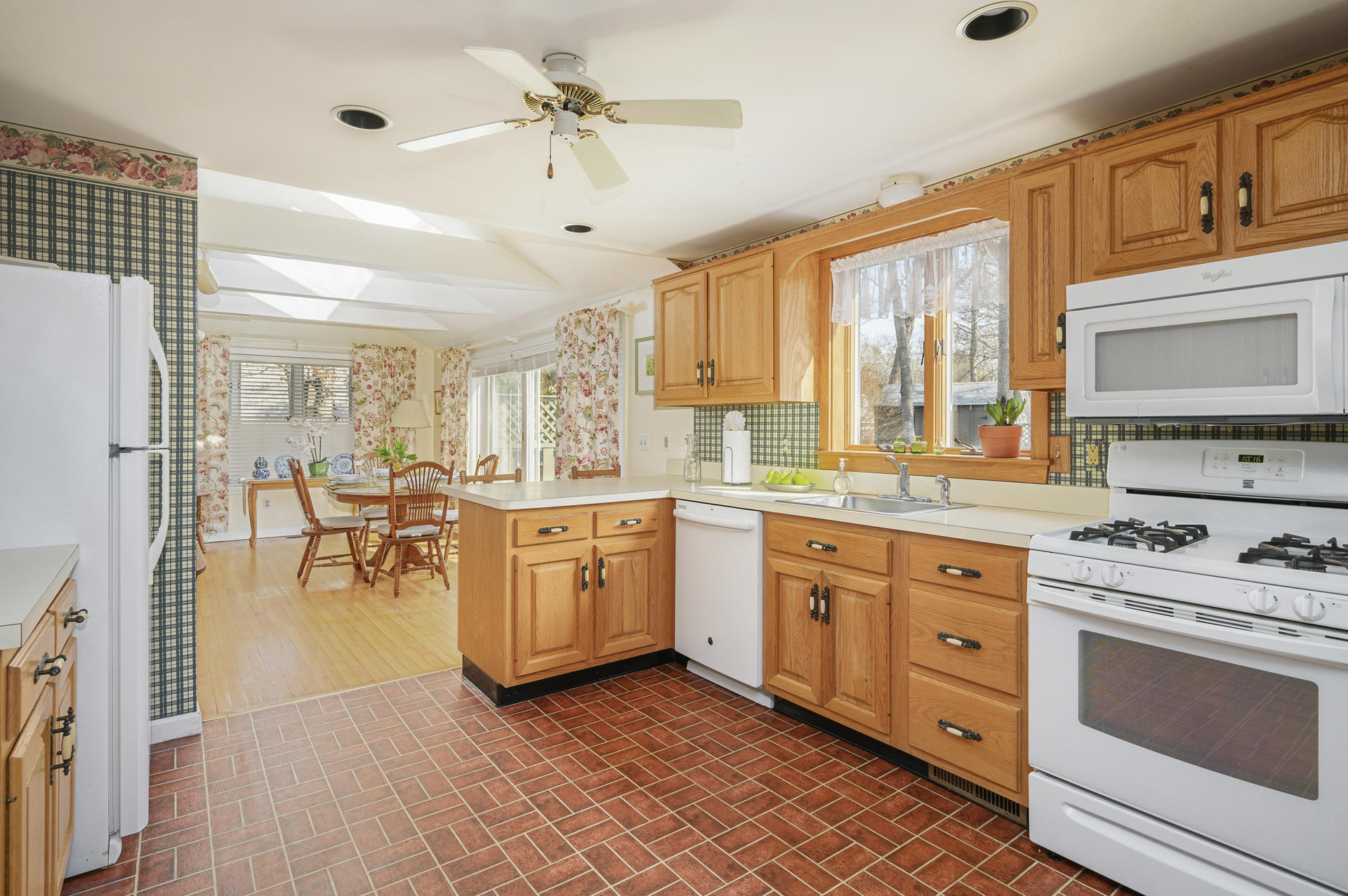26 Harbor Hills Road Centerville, MA 02632 - Photo 9 of 20 a kitchen with a stove a sink and a refrigerator