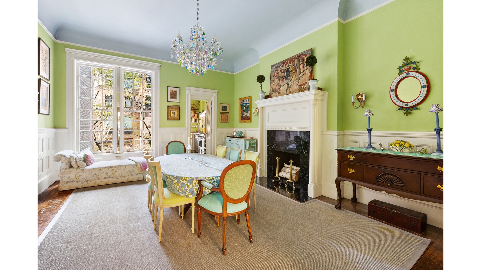321 West 77th Street Manhattan, NY 10024 - Photo 4 of 12 a living room with furniture a fireplace and a chandelier