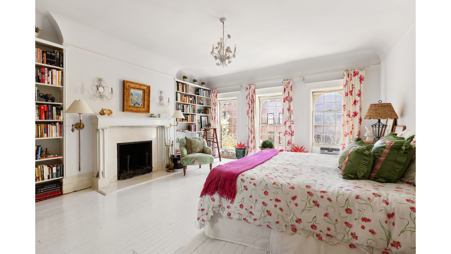 321 West 77th Street Manhattan, NY 10024 - Photo 9 of 12 a bedroom with a bed and a fireplace